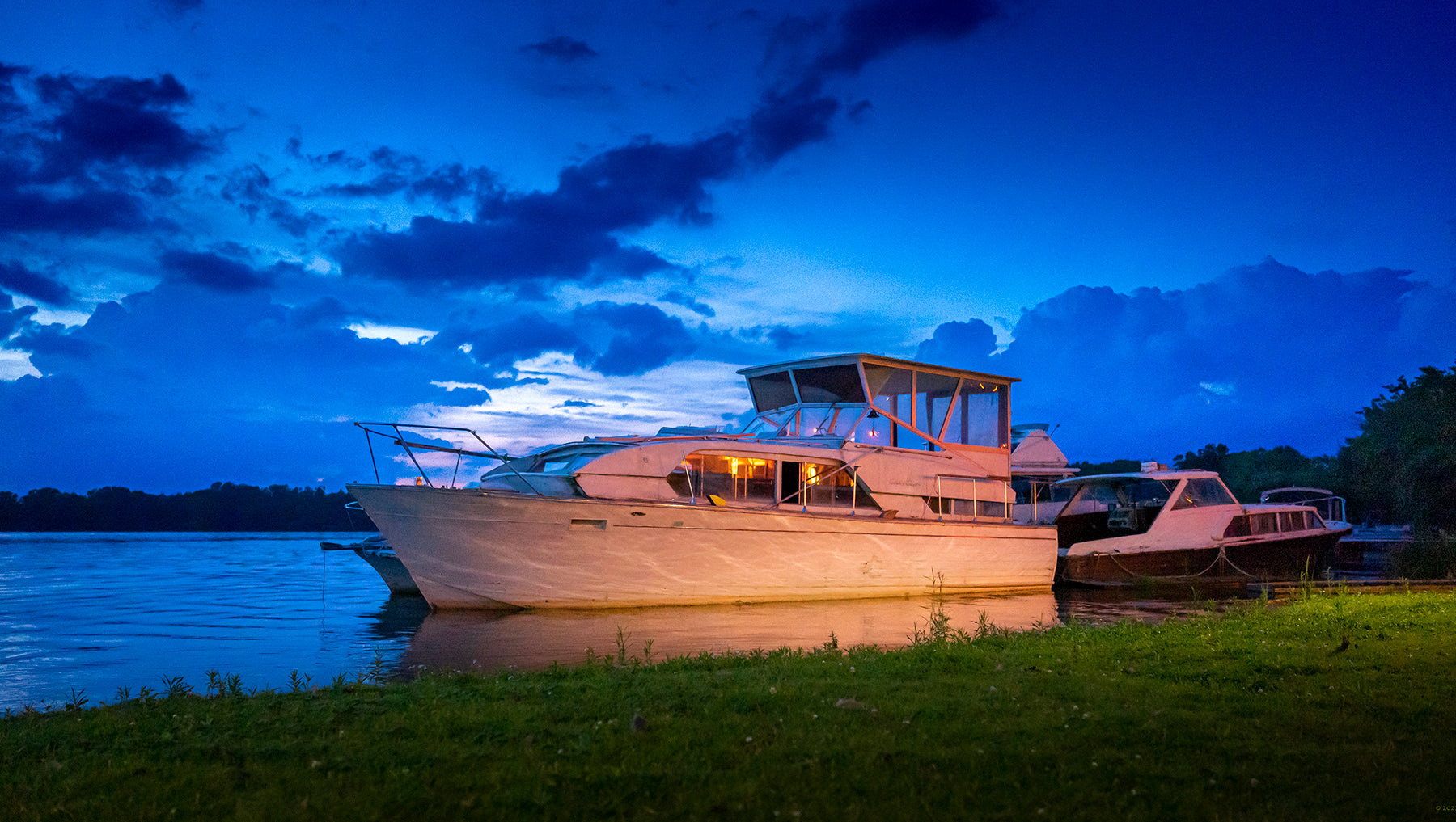 Chris Craft cabin cruiser at sunset