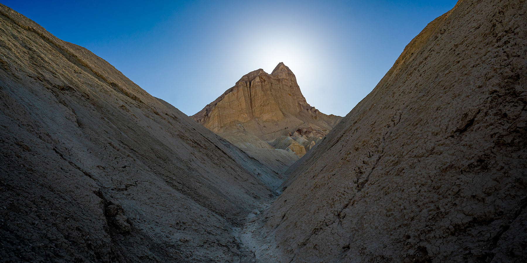 Hikers at the base of Manly Beacon in Death Valley