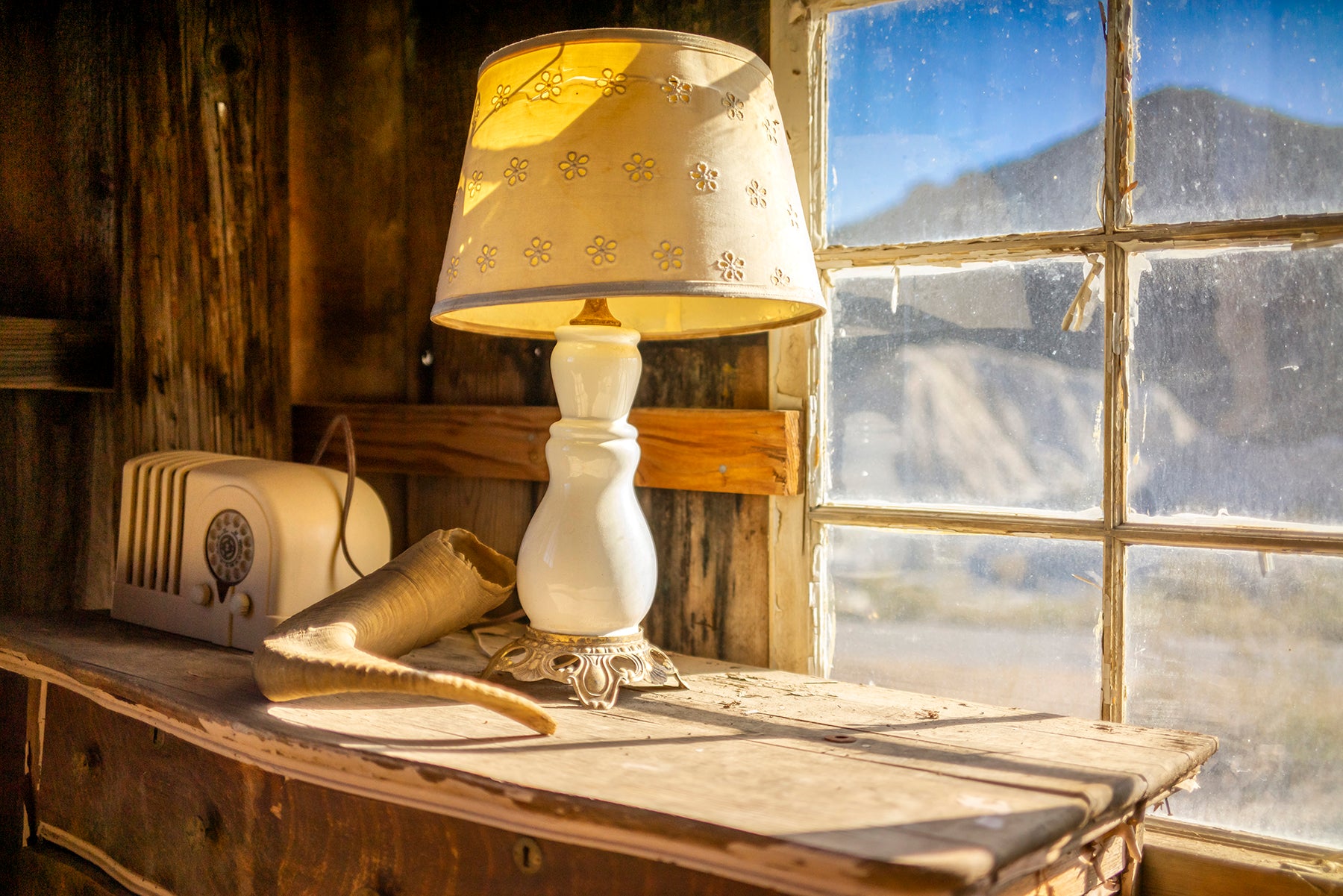 an old table lamp sitting in a barn