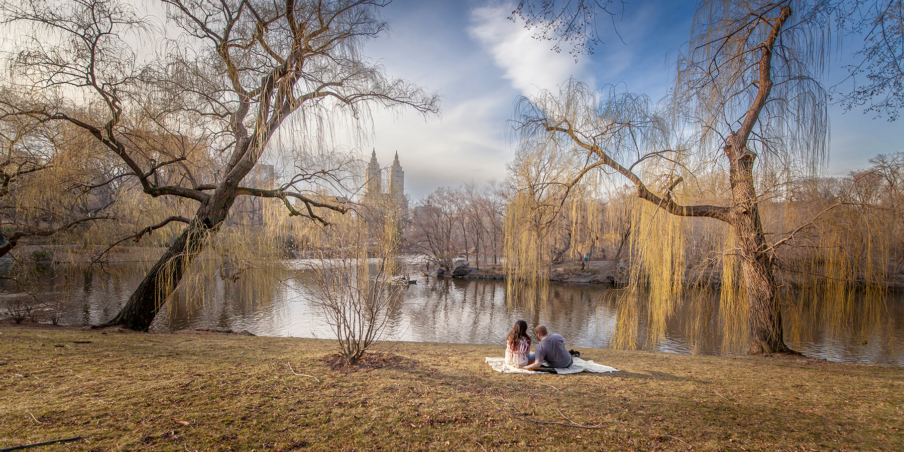 A couple enjoy Central Park Lake in NYC