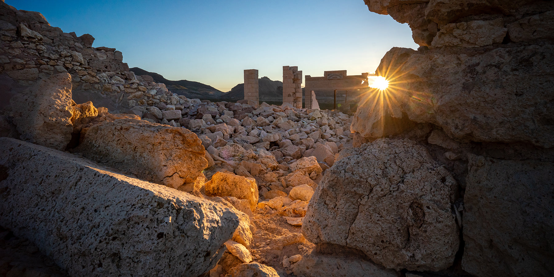 The sun rises over the ruins at the Rhyolite ghost town